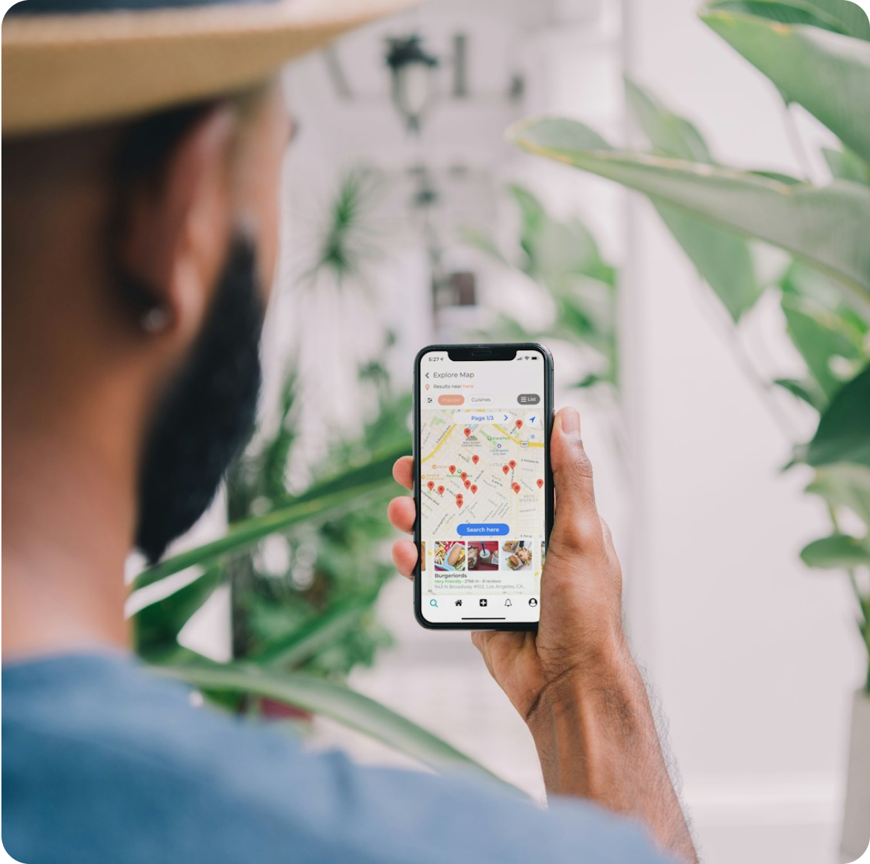 Download our app - phone on pedestal